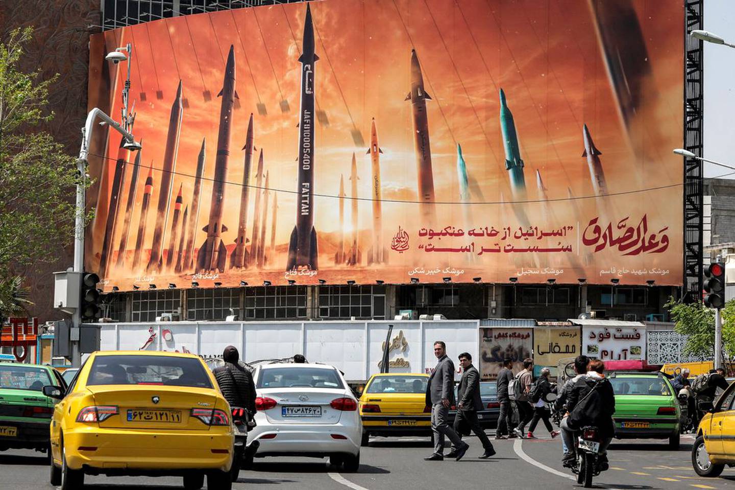 Iranian ballistic missiles are displayed on a billboard in central Tehran this week