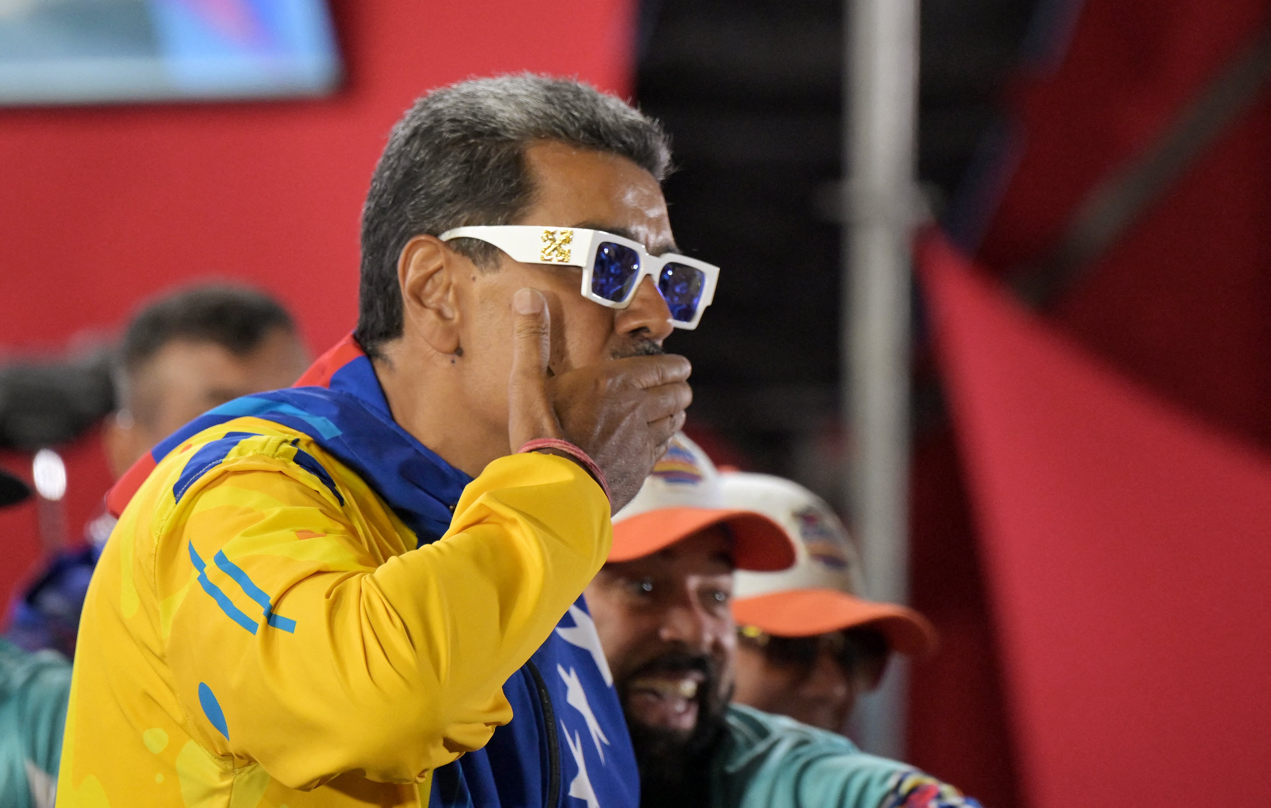 Venezuelan President and presidential candidate Nicolas Maduro blows a kiss to supporters following the presidential election results in Caracas on July 29, 2024. Nicolas Maduro was declared the winner of Venezuela's presidential election on Sunday but the opposition and key regional neighbours immediately rejected the official results. (Photo by Yuri CORTEZ / AFP)