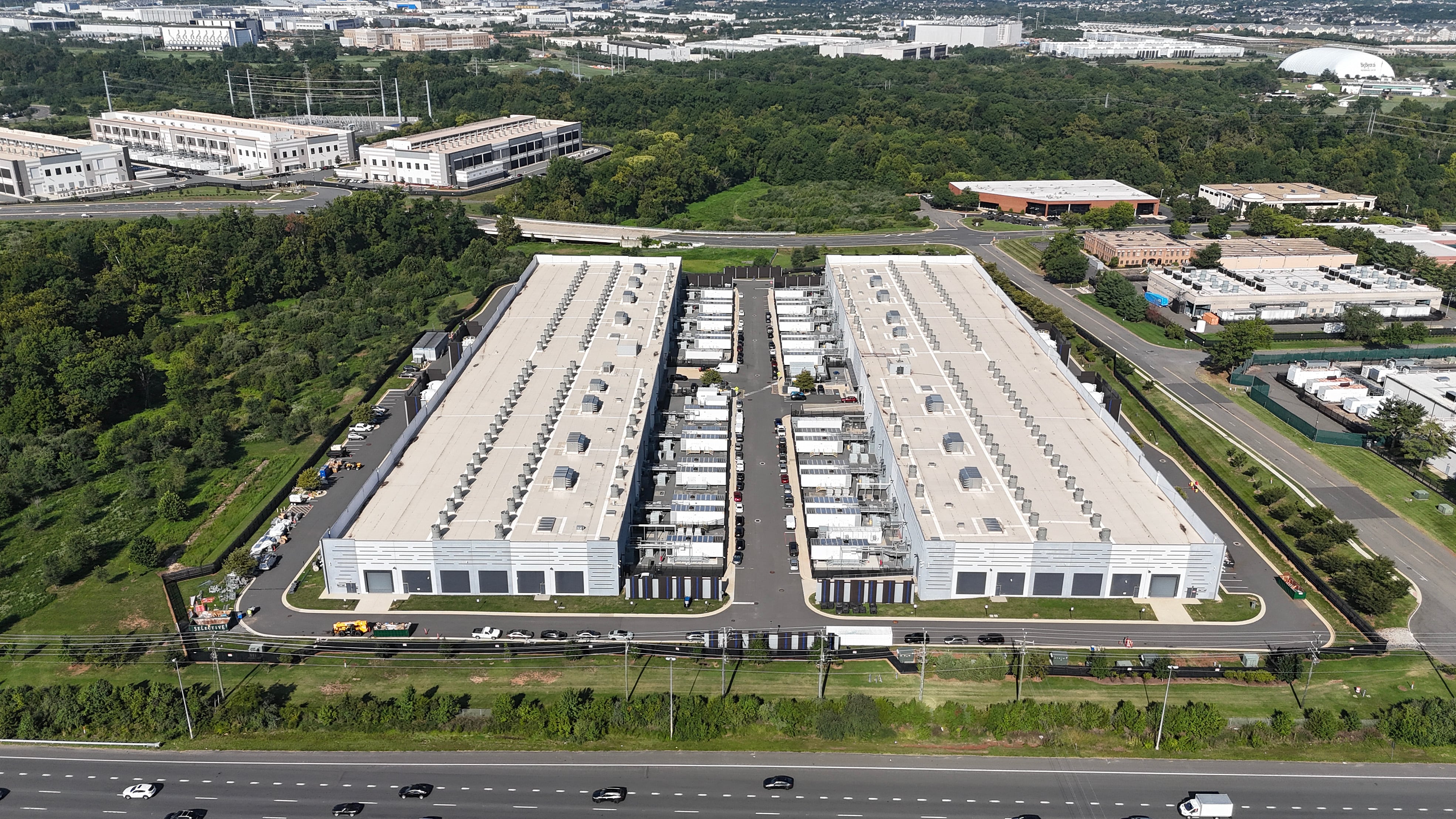 STERLING, VIRGINIA - AUGUST 26: An aerial view of an Amazon Web Services IAD10 data center on August 26, 2026 in Sterling, Virginia. In the months leading up to midterms, politicians have increasingly debated whether the economic benefits of new data centers outweigh the concerns over their high energy and water demands and impact on local communities. Anna Moneymaker/Getty Images/AFP (Photo by Anna Moneymaker / GETTY IMAGES NORTH AMERICA / Getty Images via AFP)