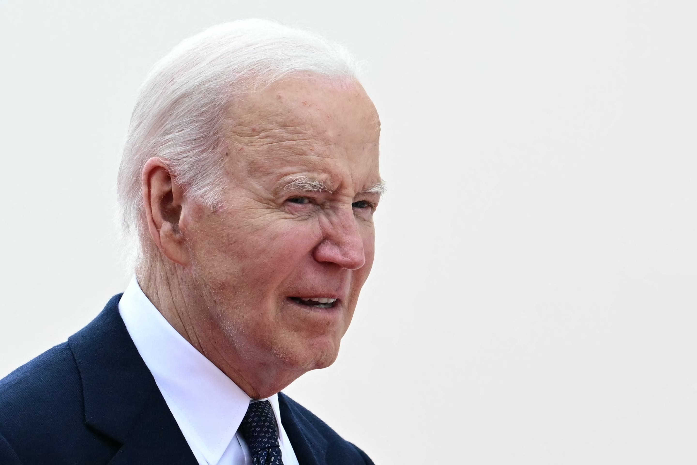 US President Joe Biden looks on at the International commemorative ceremony at Omaha Beach marking the 80th anniversary of the World War II "D-Day" Allied landings in Normandy, in Saint-Laurent-sur-Mer, in northwestern France, on June 6, 2024. The D-Day ceremonies on June 6 this year mark the 80th anniversary since the launch of 'Operation Overlord', a vast military operation by Allied forces in Normandy, which turned the tide of World War II, eventually leading to the liberation of occupied France and the end of the war against Nazi Germany. (Photo by MIGUEL MEDINA / AFP)