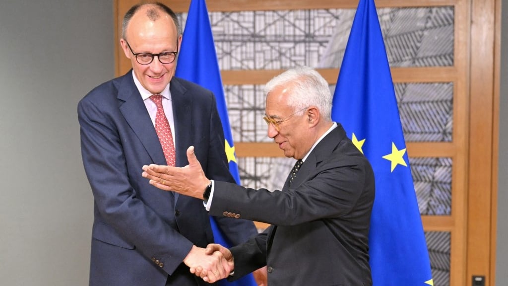 European Council President Antonio Costa (R) greets the leader of Germany's Christian Democratic Union (CDU) Friedrich Merz ahead of the Special European Council to discuss continued support for Ukraine and European defence at the EU headquarters in Brussels on March 6, 2025. (Photo by NICOLAS TUCAT / AFP)