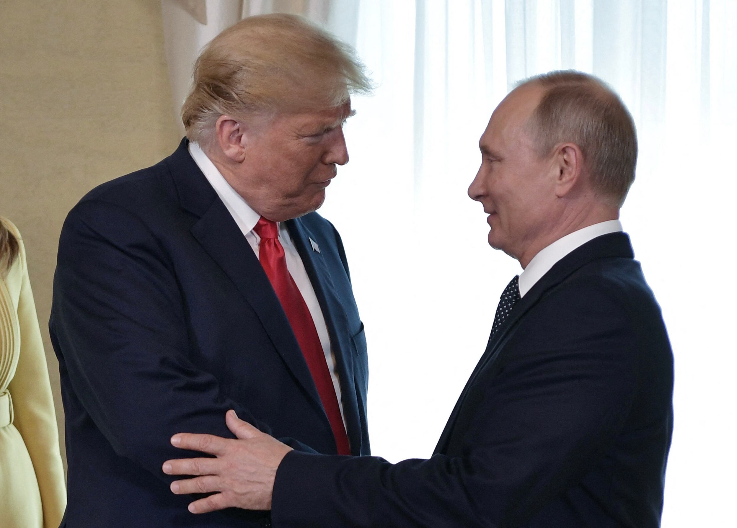 (FILES) US President Donald Trump (L) shakes hands with Russia's President Vladimir Putin ahead of a meeting in Helsinki, on July 16, 2018. US President Donald Trump and Russian counterpart Vladimir Putin could meet for a summit as early as next week, the Kremlin said on August 7, 2025. The meeting would be the first between a sitting US and Russian president since Joe Biden met Putin in Geneva in June 2021, and comes as Trump seeks to broker an end to Russia's military assault on Ukraine. (Photo by Alexey NIKOLSKY / Sputnik / AFP)