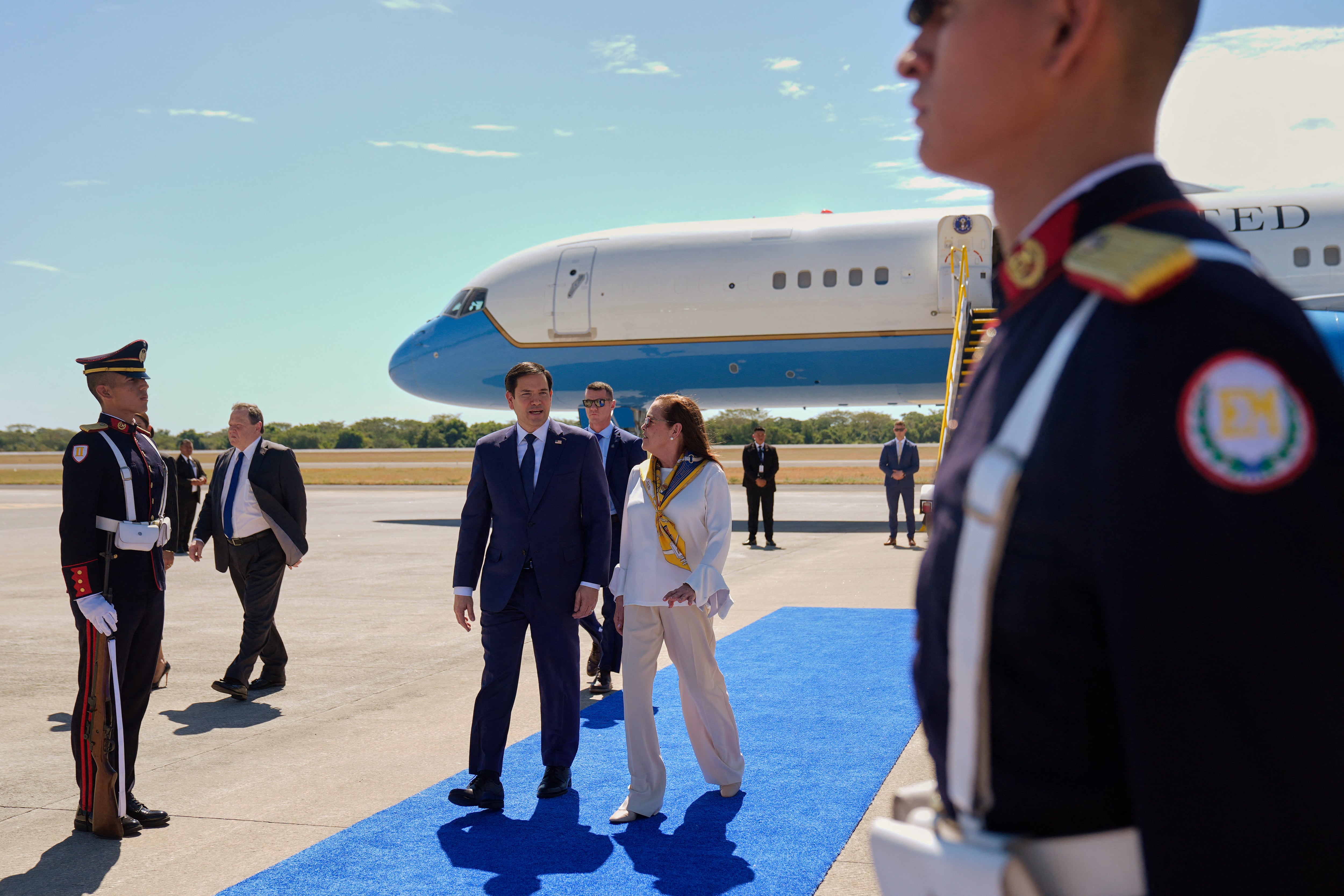 El Salvador's Foreign Minister Alexandra Hill Tinoco welcomes US Secretary of State Marco Rubio upon his arrival to the international airport in San Luis Talpa, El Salvador on February 3, 2025. (Photo by Mark Schiefelbein / POOL AP / AFP)