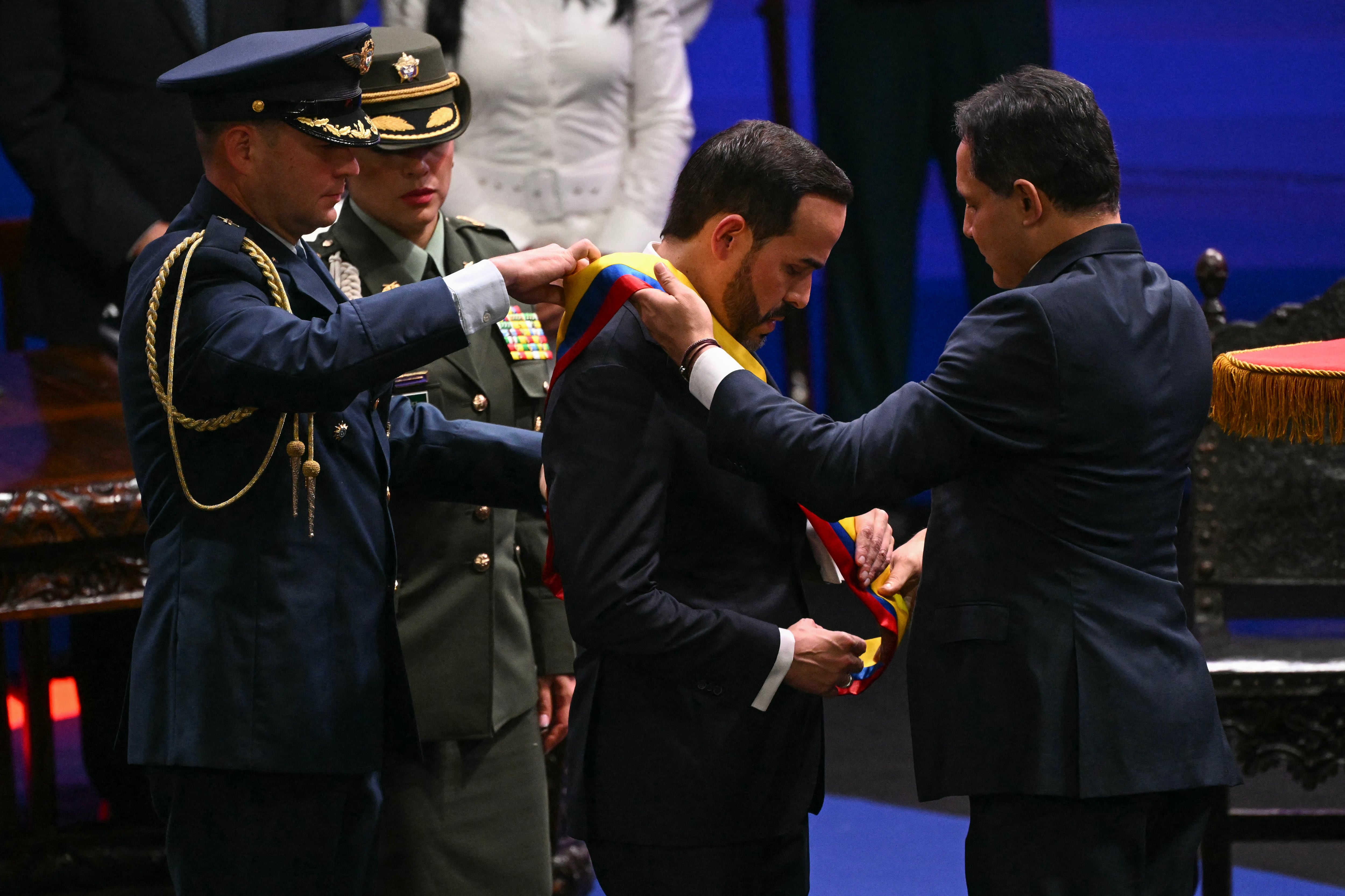 Colombia's new President Abelardo de la Espriella, receives the presidential sash from Colombian Congress President Honorio Henriquez during his inauguration ceremony at the Universidad Santiago de Cali in Cali, Colombia, on August 7, 2026. (Photo by Luis ACOSTA / AFP)