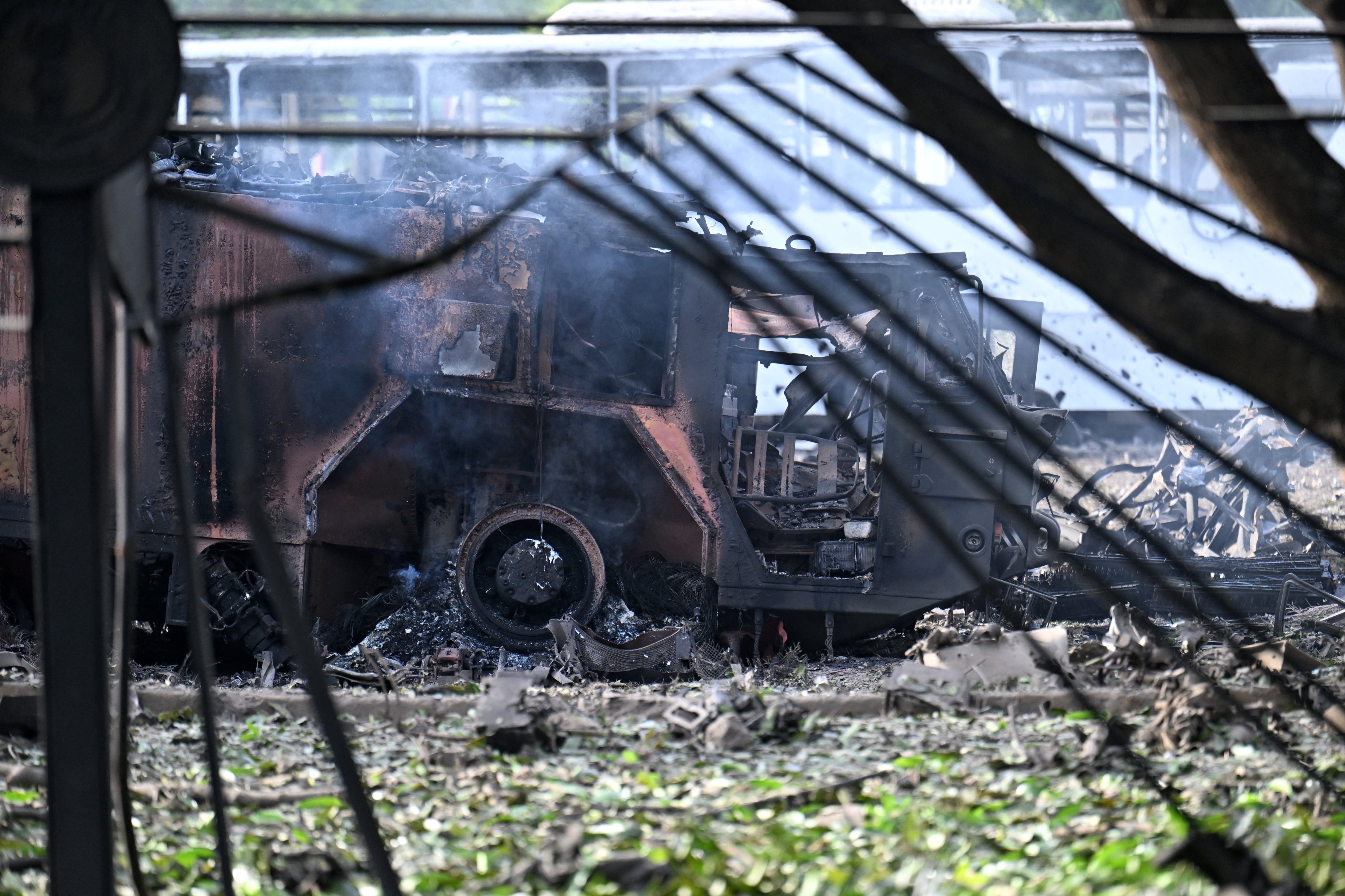 View of a destroyed truck at La Carlota air base in Caracas on December 3, 2026. President Donald Trump said Saturday that US forces had captured Venezuela's leader Nicolas Maduro after bombing the capital Caracas and other cities in a dramatic climax to a months-long standoff between Trump and his Venezuelan arch-foe. (Photo by Juan BARRETO / AFP)